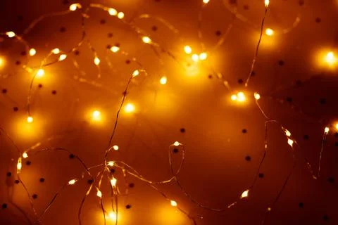Warm white led string lights blur brown background Stock Photos