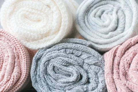 Warm winter clothes. rolled grey and pink sweaters Fotos Stock