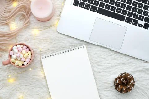 Warm winter concept. Blank notebook mock up on cozy fur fluffy white background Stock Photos