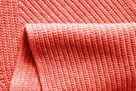 Warm wool knitted clothes background with fold in a trendy color of the yea.. Fotos Stock