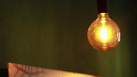 Warm Yellow Light Bulbs in a Studio Stock Footage 241322844