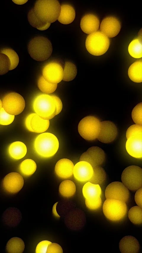 Warm yellow lights twinkle against a dark background Stock Footage 312869860