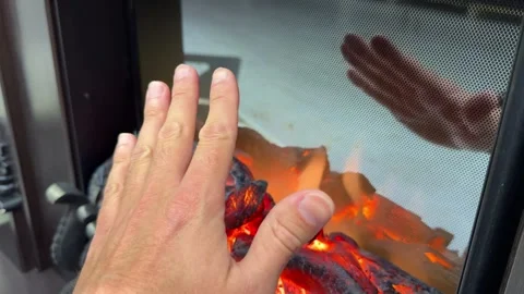 Warm your hands by the fire. Freeze your hands. Warm the man's hands by the Stock Footage 253207835