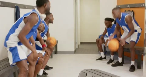 Warming up by bouncing ball african american basketball teammates passing high Видео 337096564