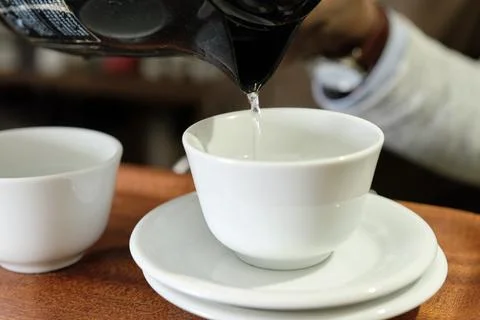 Warming up a cup of coffee Stock Photos