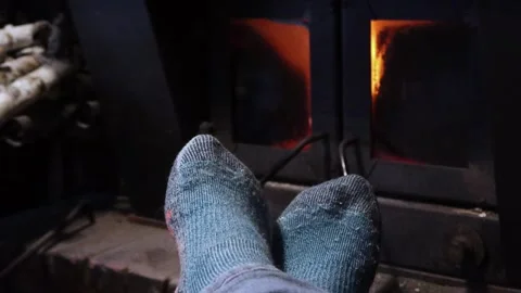 Warming Feet in front of fireplace Stock Footage 328743028