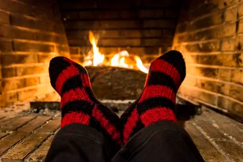 Warming in a fireplace Stock Photos