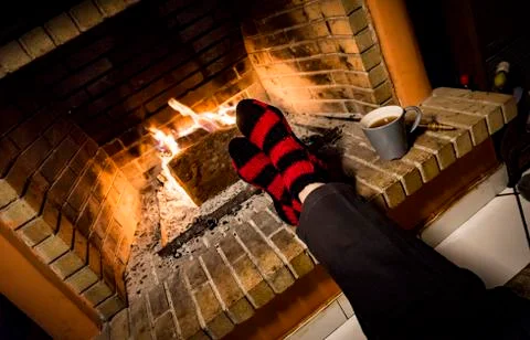 Warming in a fireplace Stock Photos