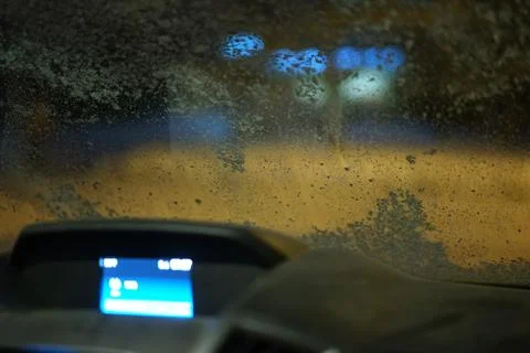 Warming up front window of a car. Stock Photos