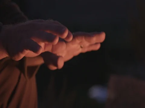 Warming Hands by a Fire Stock Footage 71624399