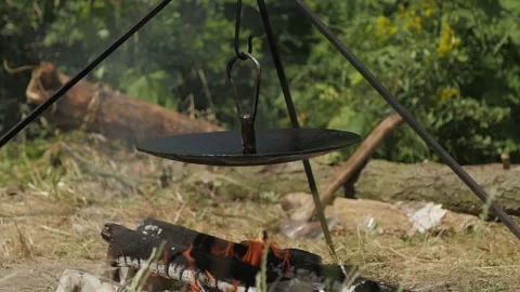 Warming pan on a campfire during a hike 스톡 동영상 144683616