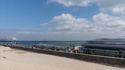 Warnemunde, Germany - May 12, 2018: The harbor entrance from Warnemunde in the Video stock 89917916
