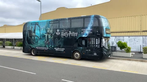 The Warner Bros. Studio Tour shuttle bus parked outside the Harry Potter studio  Stock Footage 322922430