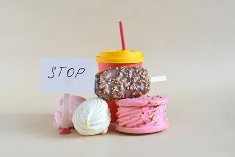 Warning about the danger of consuming large amounts of sweets and confectionery Stock Photos