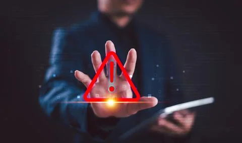 Warning alert icon concept. Programmer or developer use computer tablet to pr Stock Photos