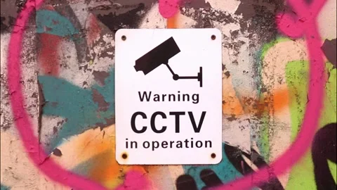 Warning CCTV in Operation Camera Security Surveillance Sign Poster Wall Building Stock Footage 287353312