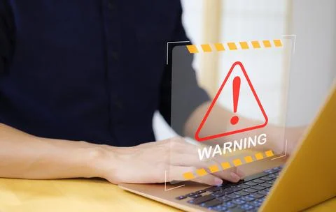 Warning cybersecurity alert system concept, system hacked on computer. Stock Photos