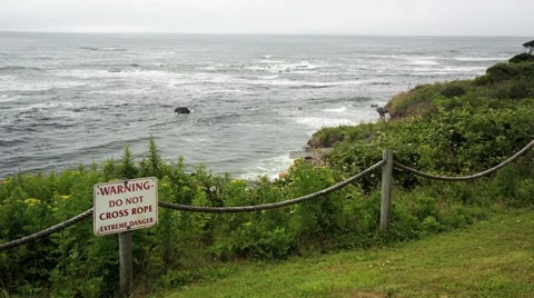 Warning, Do Not Cross Rope, Extreme Danger warning sign overlooking ocean Stock Footage 40521827