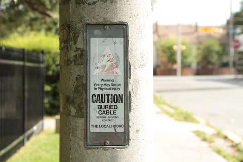 Warning entry may result in physical injury caution buried cable before digging Stock Photos