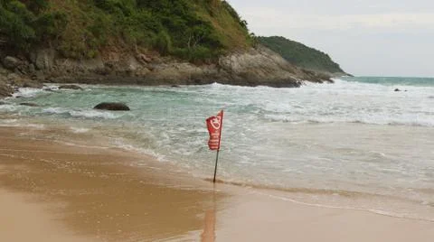 Warning flag in the sea Foto stock