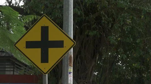 Warning intersection ahead signage, an Indonesian traffic road sign Stock Footage 137419256