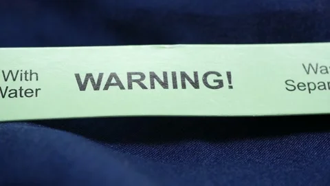 Warning label showing wash separately instructions Stock Footage 341540146