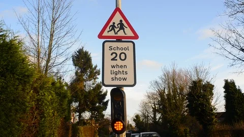 Warning lights for drivers of school ahead united kingdom Stock Footage 84733910