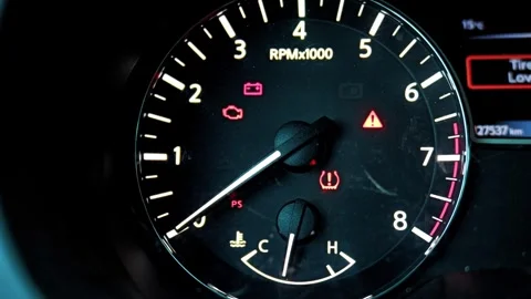 Warning lights illuminated on car dashboard tachometer gauge Stock Footage 339720620