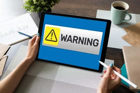 Warning message sign on screen. Virus detection security breathe hardware or Stock Photos