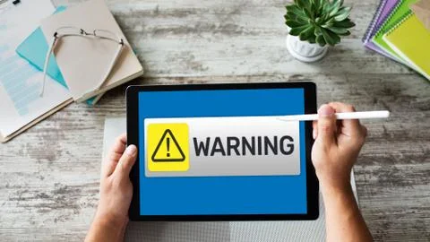 Warning message sign on screen. Virus detection security breathe hardware or Stock Photos