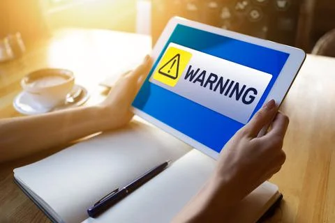 Warning message sign on screen. Virus detection security breathe hardware or Stock Photos