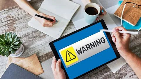 Warning message sign on screen. Virus detection security breathe hardware or Stock Photos