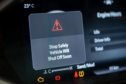 Warning message on vehicle dashboard display screen Stock Photos