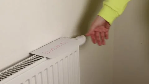 Warning note on radiator: “Do not turn on!” in bold red ink. Stock Footage 293335993