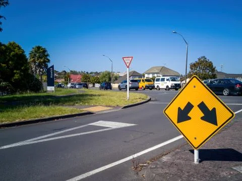 Warning for an obstacle (pass left or right) road sign Stock Photos