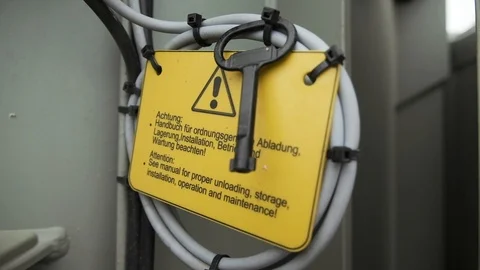Warning plate in German. The key is fixed on the plate. Video stock 124886890