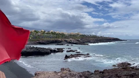 Warning red flag closeup on the beach. 4K. Stock Footage 197025834