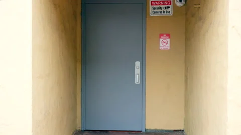 Warning Security Camera in Use Sign - Back Door Stock Footage 237842265