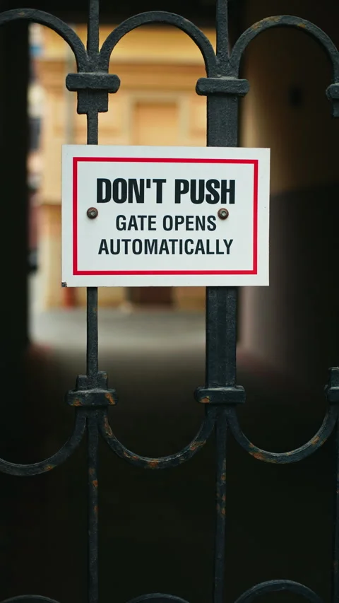 Warning Sign for Automatic Gates Please refrain from pushing the gate to ensure Stock Footage 307933408