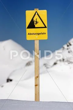 Warning Sign Danger Of Falling In The Ski Region Nearby Obersdorf In Germany