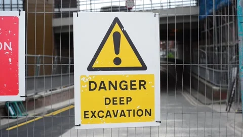 Warning sign of deep excavation keep out on construction site leeds uk Stock Footage 142999785