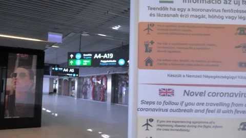 Warning Sign At Empty Corridor - Budapest Airport During Covid-19 Pandemic Stock Footage 130276554