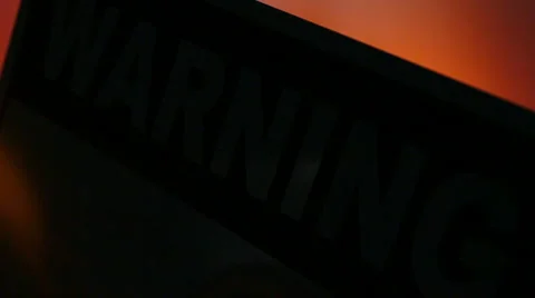 Warning sign with flashing light reflection Stock Footage 2455907