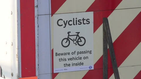 Warning sign on lorry for cyclists not to overtake on the inside uk Stock Footage 140720167