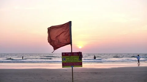 Warning sign on the ocean shore Stock Footage 264088619