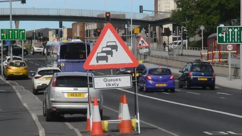 Warning sign of queuing traffic likely at roadworks leeds uk Stock Footage 144817374
