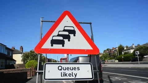 Warning sign of queuing traffic likely at roadworks leeds united kingdom Stock Footage 144817547