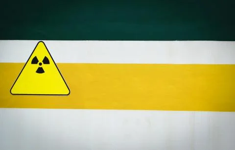 Warning sign radiation caution on wall Stock Photos