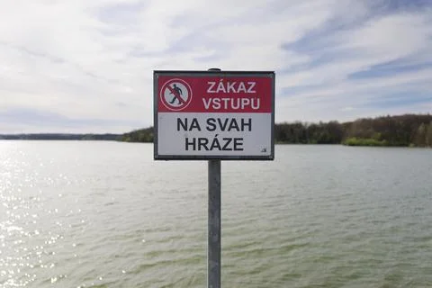 Warning sign with text - Do not enter on the dam embankment (translated from Stock Photos