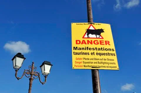 Warning sign in three languages Stock Photos